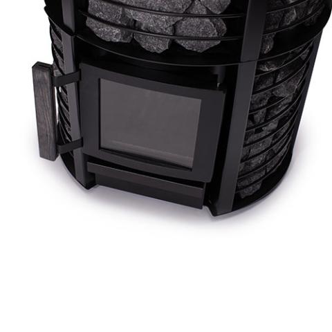 Close-up of the glass door and stone cage on the Narvi Inari Plus 16kW wood burning sauna stove