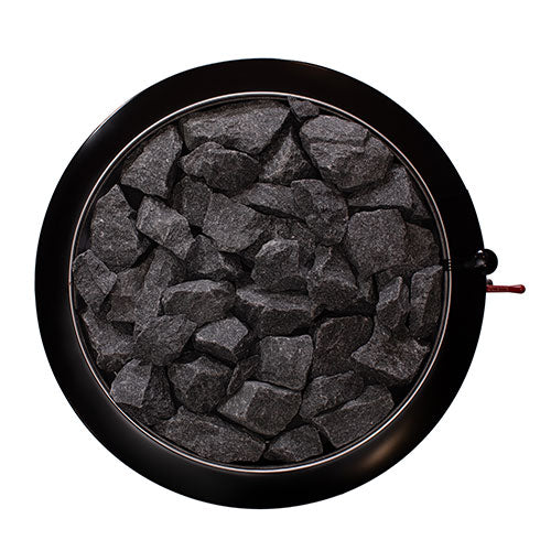 Top view of the round stone compartment filled with sauna stones on the Narvi Luosto VS 16kW wood burning sauna stove