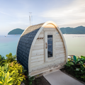 Dundalk CT MiniPOD 4-Person Sauna exterior with black shingle roof by the water