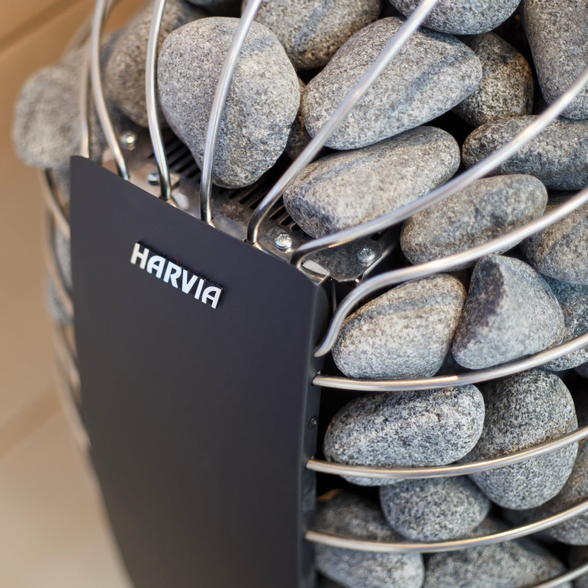 Close-up of the Harvia logo and sauna stones on the Harvia Spirit 9kW Sauna Heater